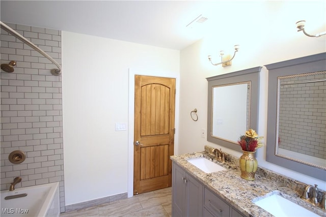 full bathroom with a sink, shower / bathing tub combination, visible vents, and double vanity