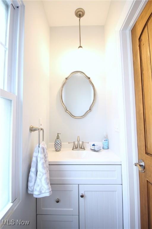 bathroom with vanity and a healthy amount of sunlight