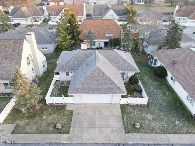 birds eye view of property with a residential view