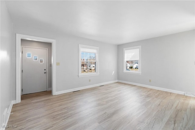 interior space featuring visible vents, baseboards, and light wood-style flooring