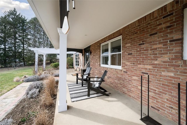 view of patio featuring a pergola