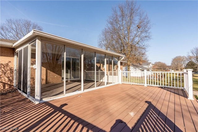 wooden terrace featuring a sunroom