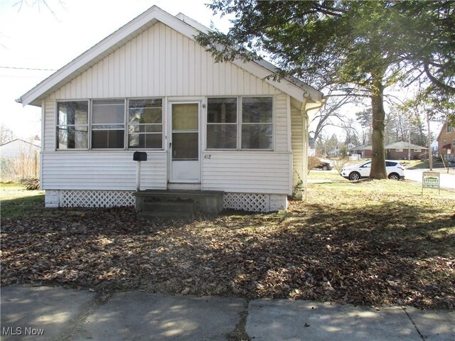 bungalow-style home with entry steps