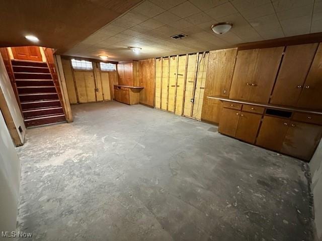 basement featuring stairway and visible vents