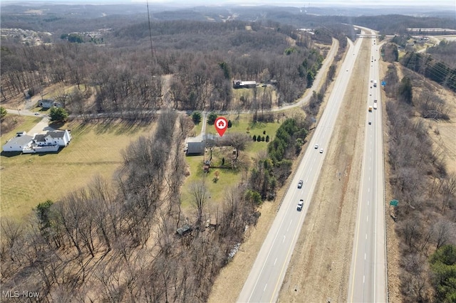 birds eye view of property featuring a rural view