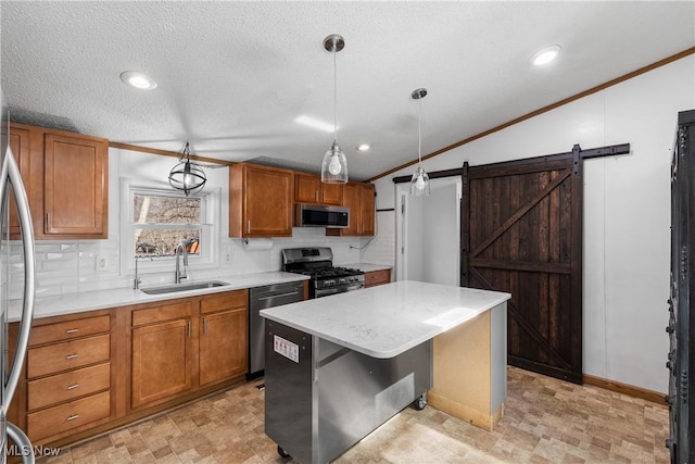 kitchen with a sink, stainless steel appliances, brown cabinets, and ornamental molding