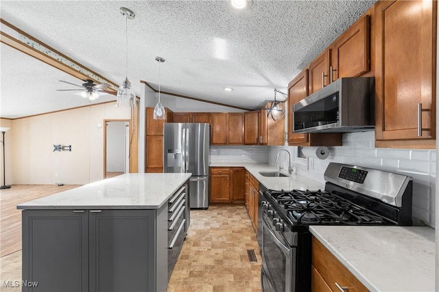 kitchen with brown cabinets, a sink, a center island, stainless steel appliances, and lofted ceiling