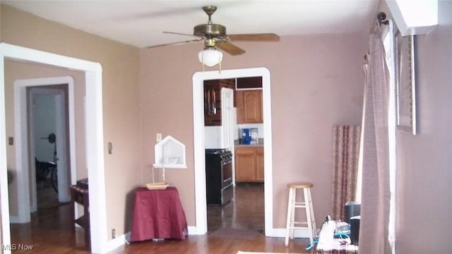 hall with wood finished floors and baseboards