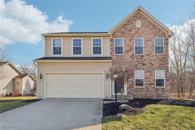 view of front of house featuring concrete driveway, a garage, and a front yard