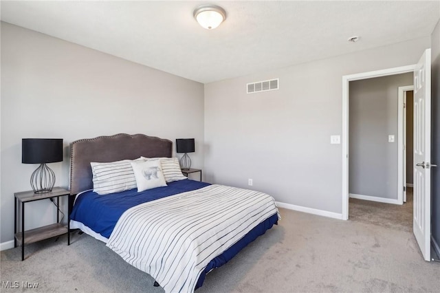 bedroom with baseboards, visible vents, and carpet floors