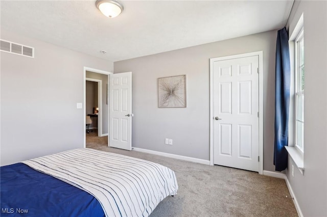 bedroom with visible vents, baseboards, and carpet floors