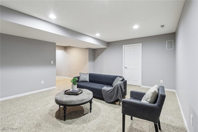 carpeted living room featuring visible vents, recessed lighting, and baseboards