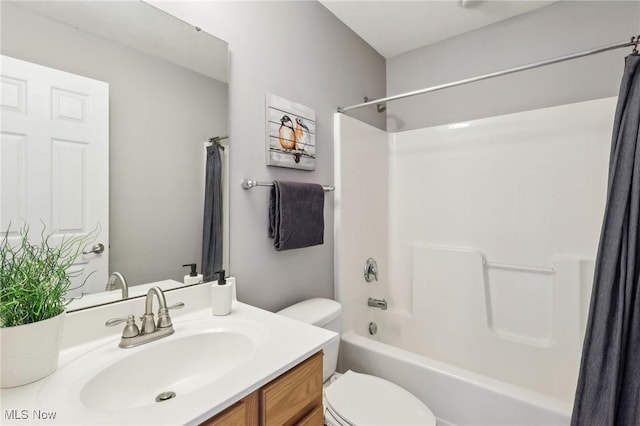 full bath featuring shower / tub combo with curtain, toilet, and vanity