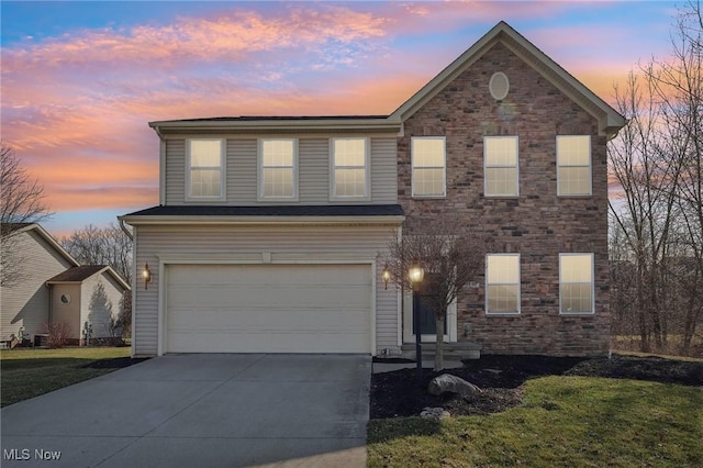 traditional-style home with concrete driveway and a garage