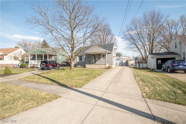 bungalow with a residential view, a porch, a front yard, an outdoor structure, and a gate