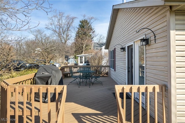 deck with outdoor dining space