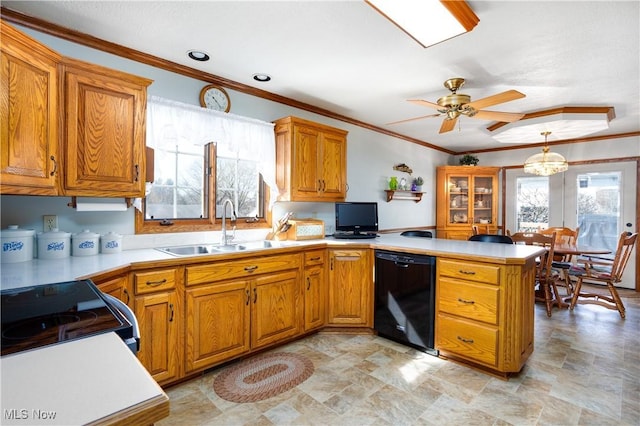 kitchen featuring a sink, black appliances, a peninsula, and light countertops