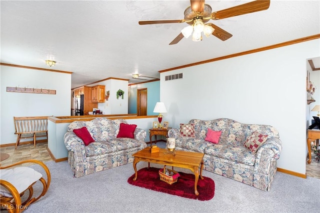 carpeted living area with visible vents, a textured ceiling, ceiling fan, and ornamental molding