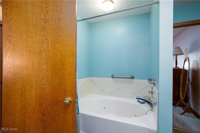 full bathroom featuring a whirlpool tub