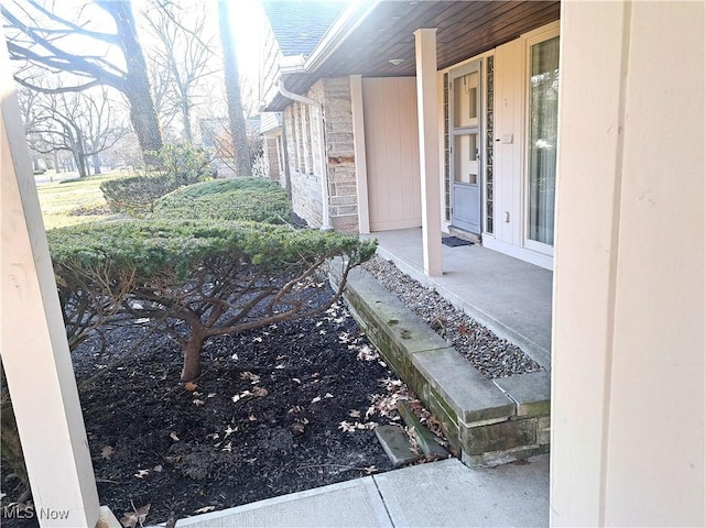 doorway to property with stone siding