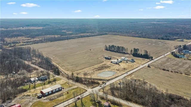 birds eye view of property with a rural view