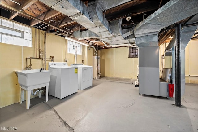 basement with separate washer and dryer and water heater