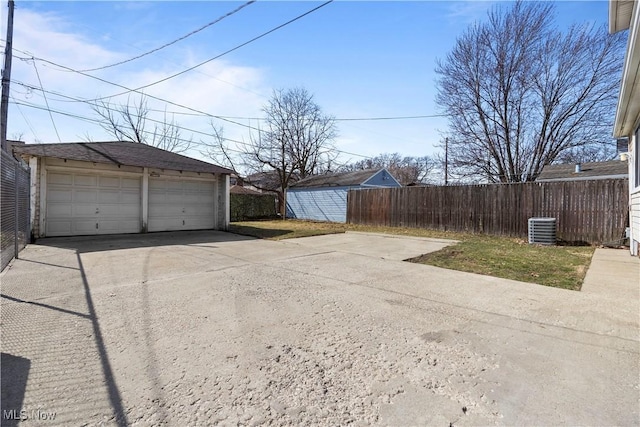 detached garage with cooling unit and fence