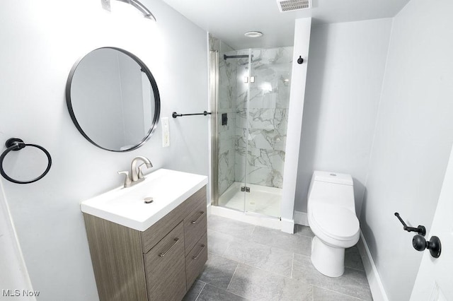 bathroom with vanity, baseboards, visible vents, a marble finish shower, and toilet