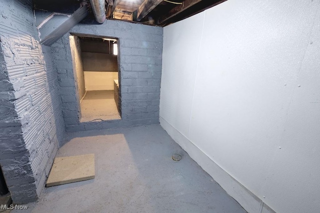 unfinished below grade area with concrete block wall