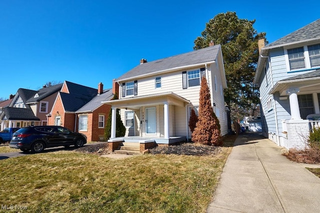 view of front of house with a porch, a front lawn, and a residential view