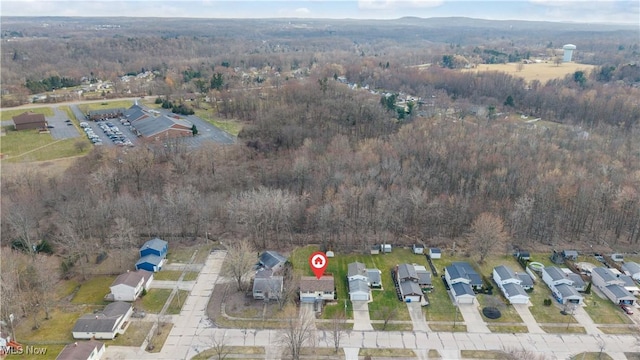 drone / aerial view with a view of trees