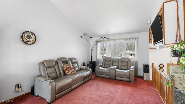 carpeted living area with vaulted ceiling