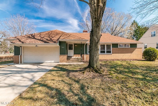 ranch-style house featuring brick siding, a shingled roof, concrete driveway, a chimney, and an attached garage