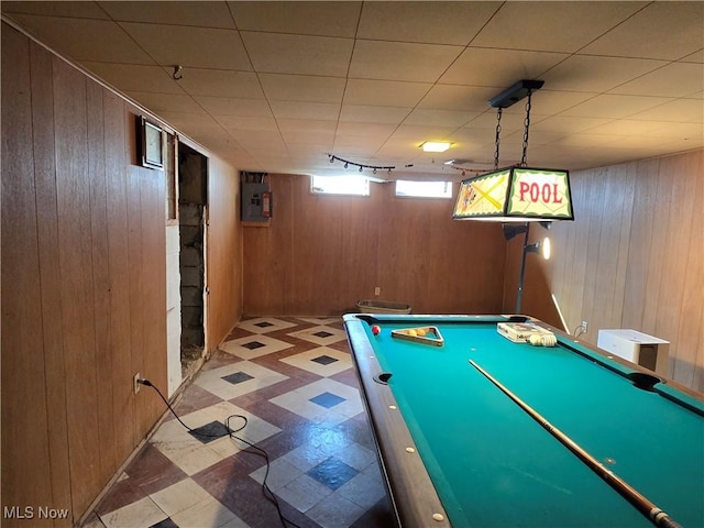 playroom featuring tile patterned floors, wooden walls, billiards, and electric panel