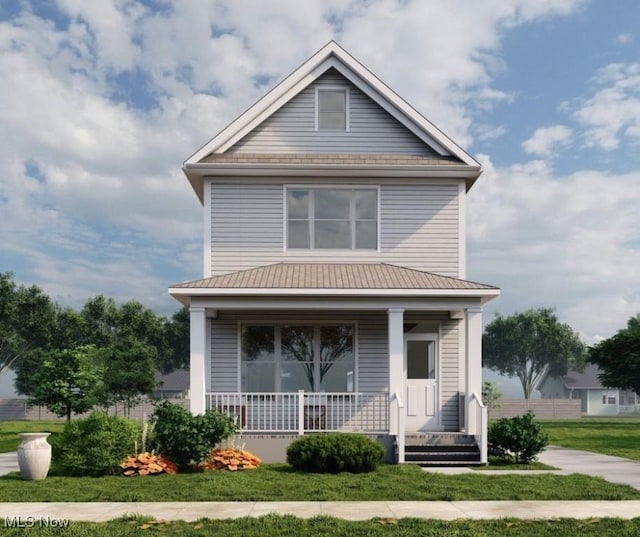 american foursquare style home featuring covered porch and a front yard