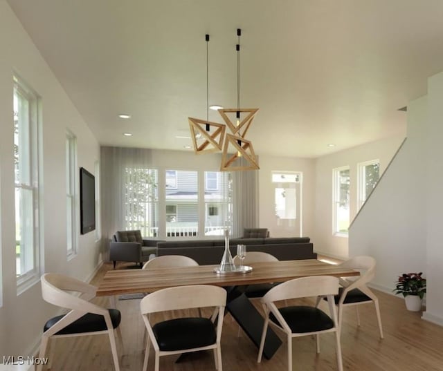 dining room featuring recessed lighting, baseboards, and wood finished floors