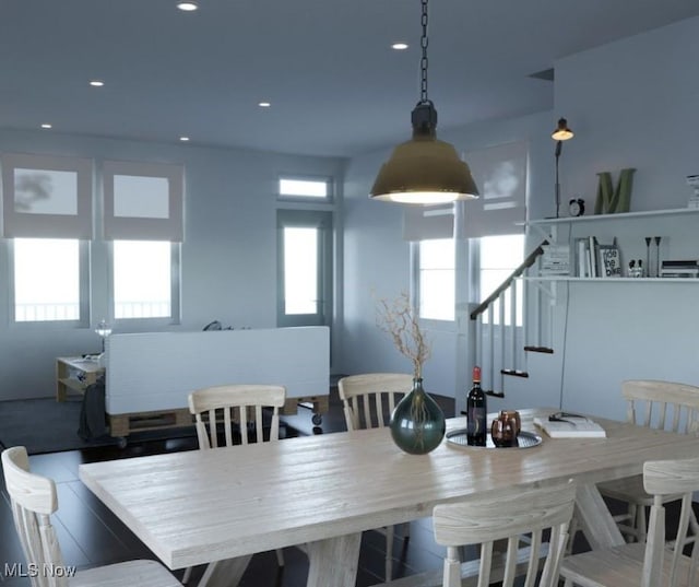 dining space featuring recessed lighting, stairway, and wood finished floors