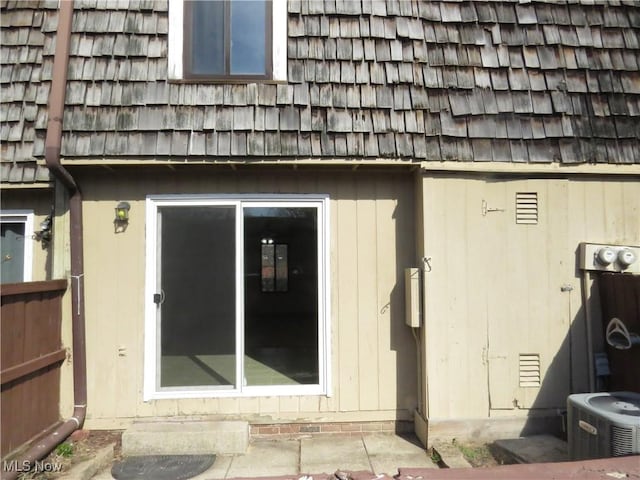 doorway to property featuring cooling unit