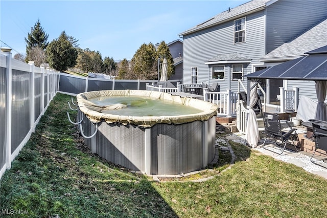 view of yard featuring a fenced backyard and a wooden deck