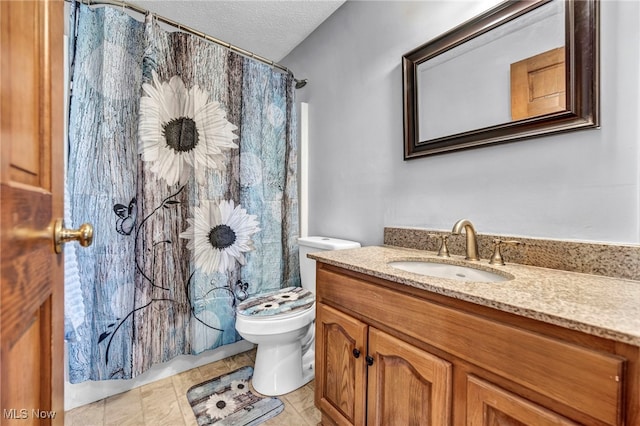 full bathroom with a shower with curtain, a textured ceiling, vanity, and toilet