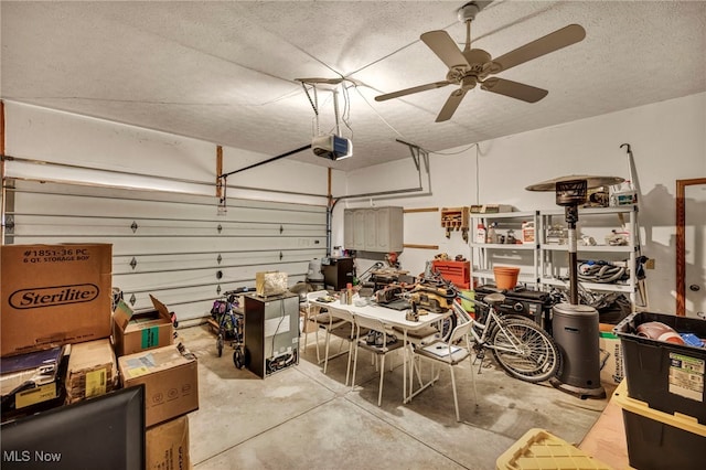 garage with a garage door opener and a ceiling fan