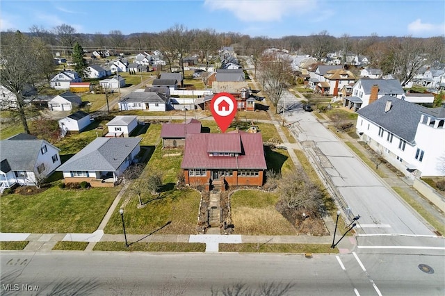 birds eye view of property with a residential view