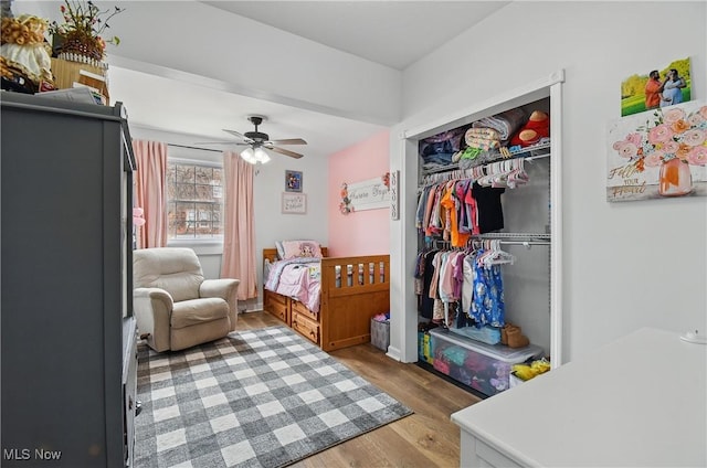 bedroom featuring a closet and wood finished floors