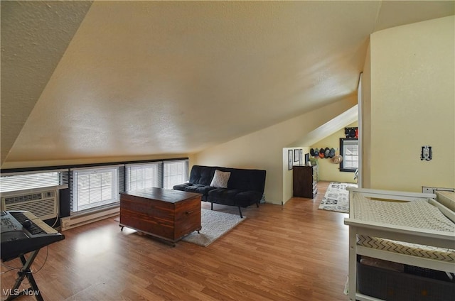 living room featuring lofted ceiling and light wood-style floors