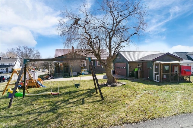 view of yard with a playground and a garage