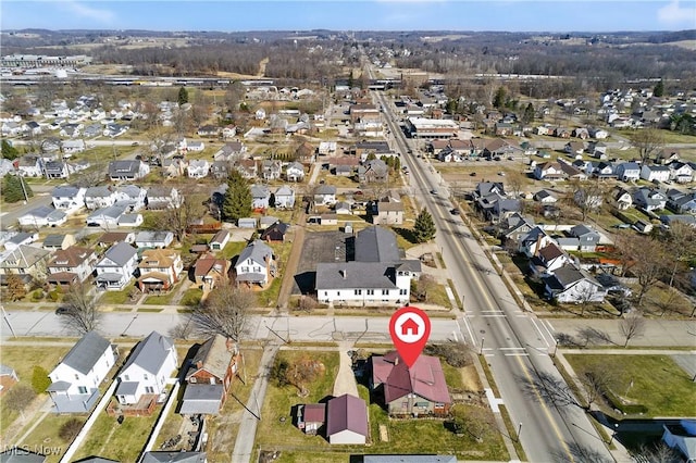 birds eye view of property with a residential view