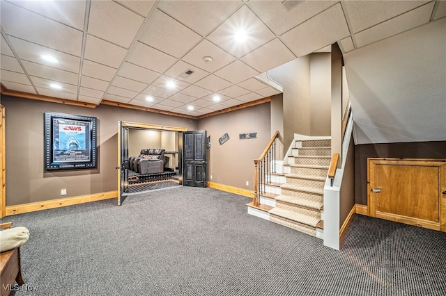 interior space with visible vents, baseboards, carpet, stairway, and a paneled ceiling