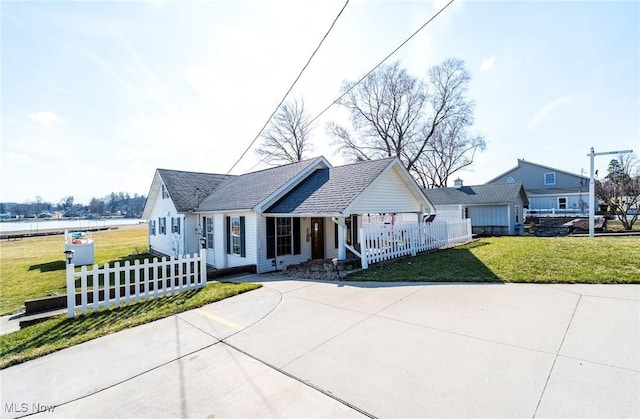view of front of house featuring a porch, a front yard, and fence