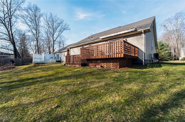 421 Hills Creek Rd, Brookfield, OH 44403 - back of house with a wooden deck, a yard, and central AC unit