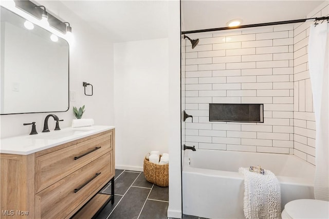 full bath with shower / bath combo with shower curtain, toilet, vanity, and tile patterned flooring